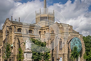 A view of Blackburn cathedral with statue of Queen Victoria photo