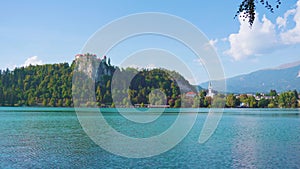 View of Bled lake against old castle and Saint Martin church