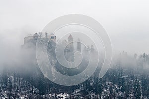 View of Bled lake in the morning, Slovenia. Fog over the city and mountains