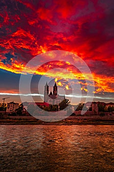 View of bloody sunset in front of cathedral in Magdeburg, Germany, Autumn, red cloudy sky