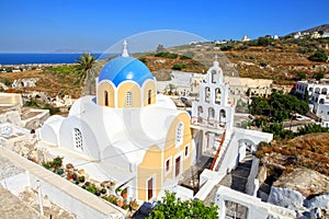 View of a blue domed church in the village of Vothonas in Santorini, Greece