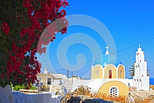 View of a blue domed church in the village of Vothonas in Santorini, Greece