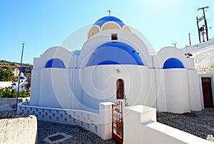 View of a blue domed church in the village of Vothonas in Santorini, Greece