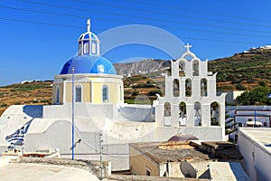 View of a blue domed church in the village of Vothonas in Santorini, Greece