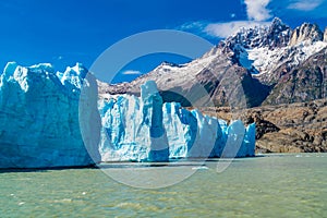 View of blue Iceberg of Grey Glacier in Grey Lake and beautiful snowy mountain