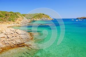 View on the blue lagoon on the beach Es Grau on Menorca