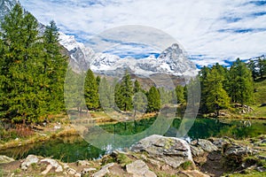 View of the Blue lake Lago Blu near Breuil-Cervinia and Cervino Mount Matterhorn in Val D`Aosta, Italy