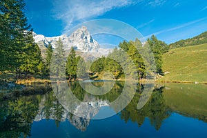 View of the Blue lake Lago Blu near Breuil-Cervinia and Cervino Mount Matterhorn in Val D`Aosta, Italy
