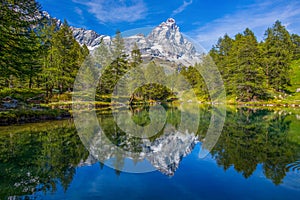 View of the Blue lake Lago Blu near Breuil-Cervinia and Cervino Mount Matterhorn in Val D`Aosta,Italy. photo