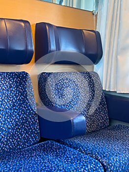 View of the blue passenger seats in the train interior