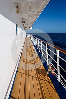 View of blue sky and blue ocean on sunny day from outside deck of cruise ship, Atlantic Ocean