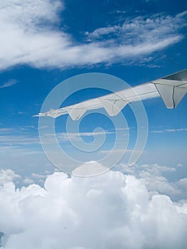 View of blue sky and jet plane wing