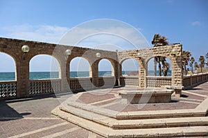 view from the boardwalk of Givat Aliya Promenade near the Arches Beach on the seafront in Jaffa at israel under blue sky