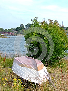 View of boat on the coast of Baltic sea on the island of Sveaborg in Finland