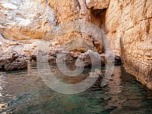 view from the boat of the famous rock caves of the Gargano coast