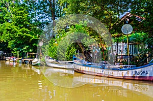 view of a boat moored and waiting do a cruise on the ropotamo river in Bulgaria