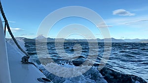 View from a boat to the Avachinskaya Bay of the Pacific Ocean off the southeastern coast of the Kamchatka Peninsula.