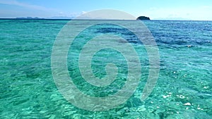 View from Boat to Crystal Clear Turquoise Sea Water with Coral Reef