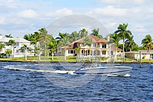 Boat and waterfront home by the bay near Cape Coral, Florida, U.S.A photo