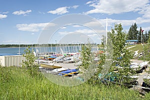 View of boat yard with small sailing boats and kayaks