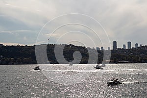 View of boats on Bosphorus and European side of Istanbul. It is a sunny summer day.