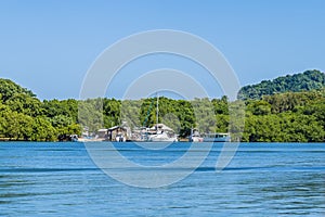 A view of boats in a cove next to West Bay on Roatan Island