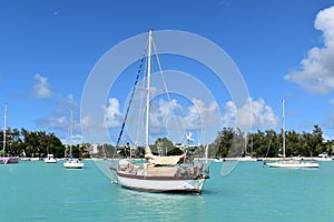 View of boats moored in the beautiful Grand Bay lagoon, amazing colors. Vacations background.