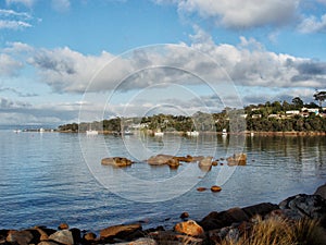 View of boats moored in Coles Bay photo
