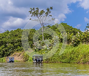 A view of boats navigating the Tortuguero River in Costa Rica