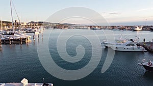 View of boats in the port. The beach is paradise