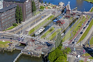 View of boats sailing through a canal in the city of Rotterdam