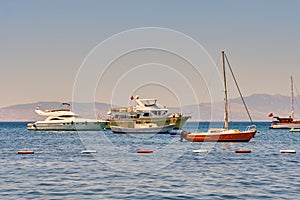 View of boats and yachts in the Aegean Sea from the Bodrum embankment, Turkey.