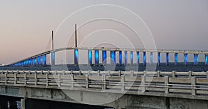 The view of the Bob Graham Sunshine Skyway Bridge lit in blue lights near St Petersburg, Florida, U.S