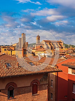 View of Bologna Cathedral and towers towering above of the roofs of Old Town in medieval city Bologna in the sunrise
