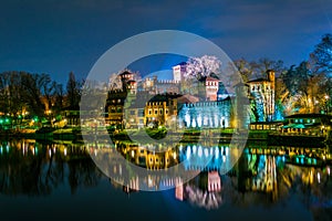 view of borgo medievale castle looking buidling in the italian city torino during night...IMAGE photo