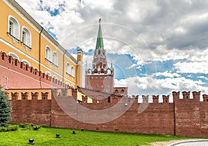 View of Borovitskaya Tower with Kremlin red brick wall from Alexander Garden in Moscow