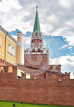 View of Borovitskaya Tower with Kremlin red brick wall from Alexander Garden in Moscow
