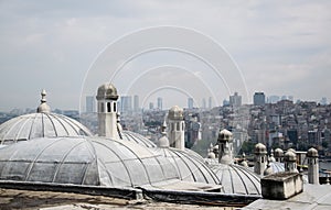 The view of the Bosphorus from the courtyard of Suleymaniye Mosque throught the domes of madrasas in Istanbul, Turkey