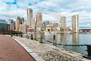 View of Boston downtown and waterfront uder a partly cloudy autumnal sky
