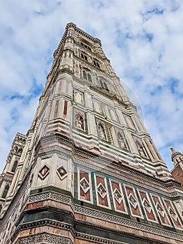 View from bottom of cathedral of Santa Maria del Fiore, florence Firenze, italy with blue sky and clouds, travel concept