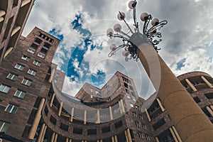 View from bottom to top of the monumental round building, street light and cloudy sky, Yerevan