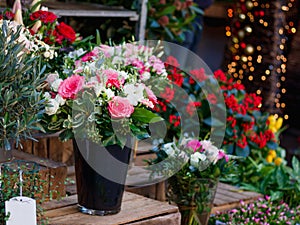 View of a bouquet of scarlet roses in a street flower shop in Paris