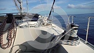 View from bow of moving yacht with ropes and winches