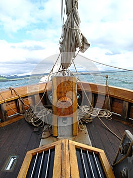 View of the bow of an old sailing ship sailing in the Arctic sea photo
