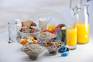 View of bowl of cereals, fruit salad and food