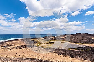 View of the brackish water lagoon that forms near the lighthouse of the island of Lobos in Fuerteventura, Spain