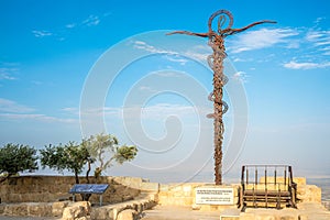 View at the The Brazen Serpent sculpture and view towards the Promised Land–Dead Sea and Jerusalem - Mont Nebo, Jordan