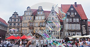 View of Bremen market square with Town Hall, Roland statue and crowd of people, historical center, Germany