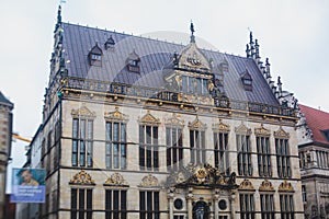 View of Bremen market square with Town Hall, Roland statue and crowd of people, historical center, Germany