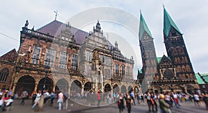 View of Bremen market square with Town Hall, Roland statue and crowd of people, historical center, Germany